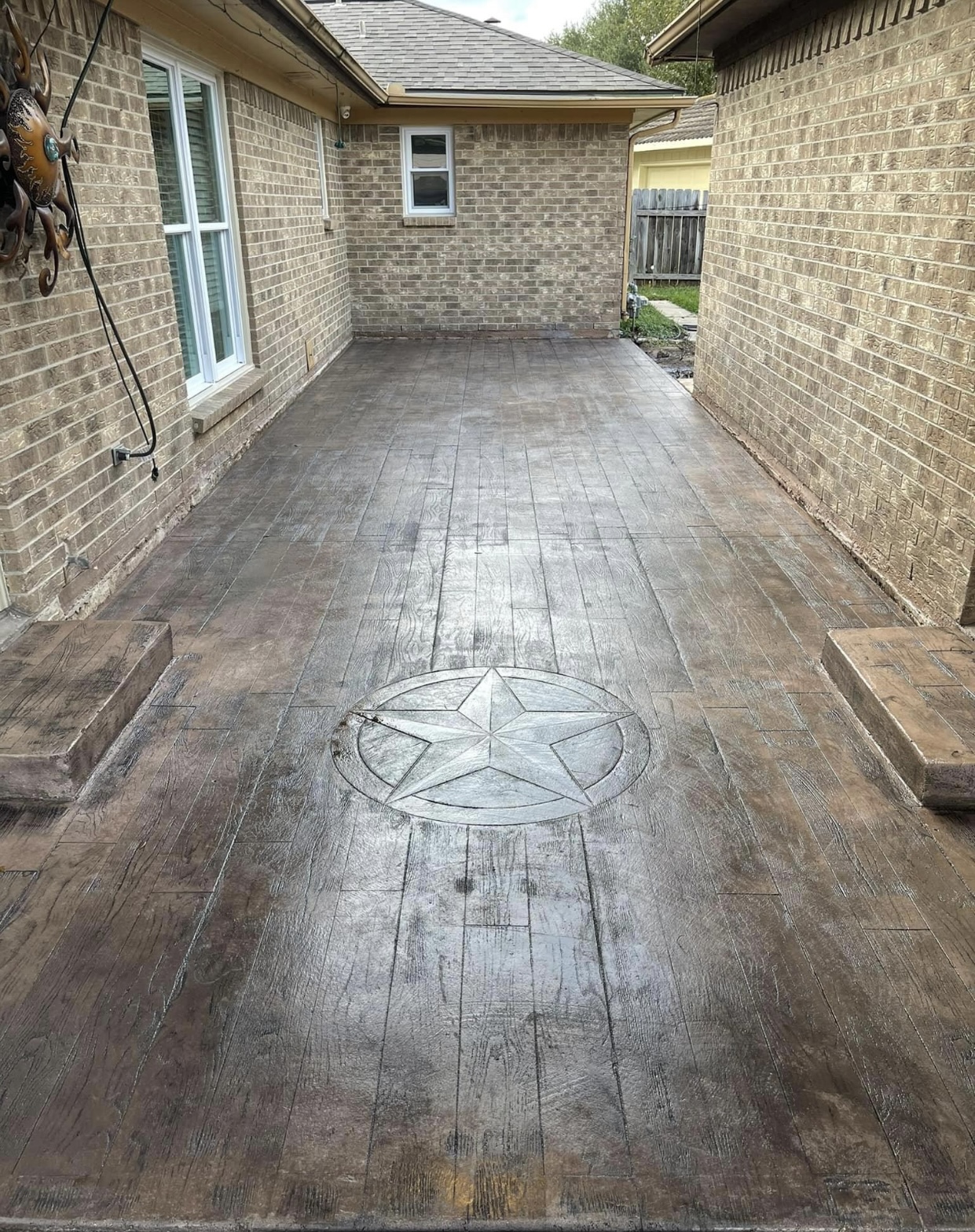 Stamped Wood-Plank Patio with Texas Star